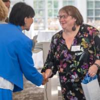 Elizabeth Arnold receiving her bag